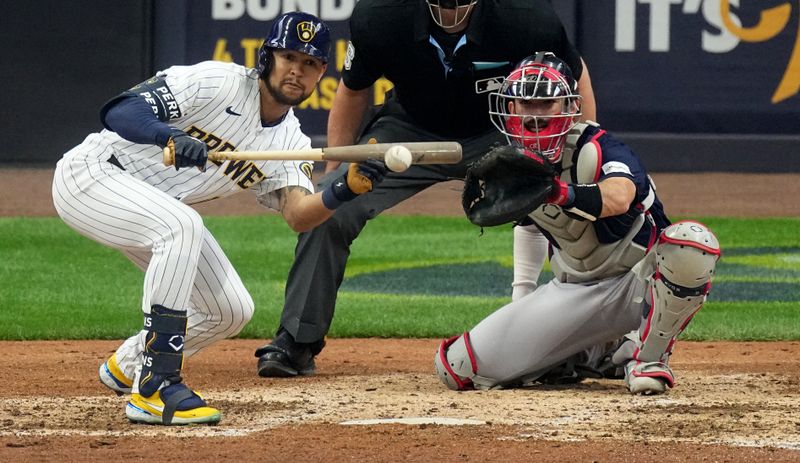 Apr 23, 2023; Milwaukee, Wisconsin, USA; Milwaukee Brewers center fielder Blake Perkins (16) bunts during the seventh inning of their game against the Boston Red Sox at American Family Field. Mandatory Credit: Mark Hoffman-USA TODAY Sports