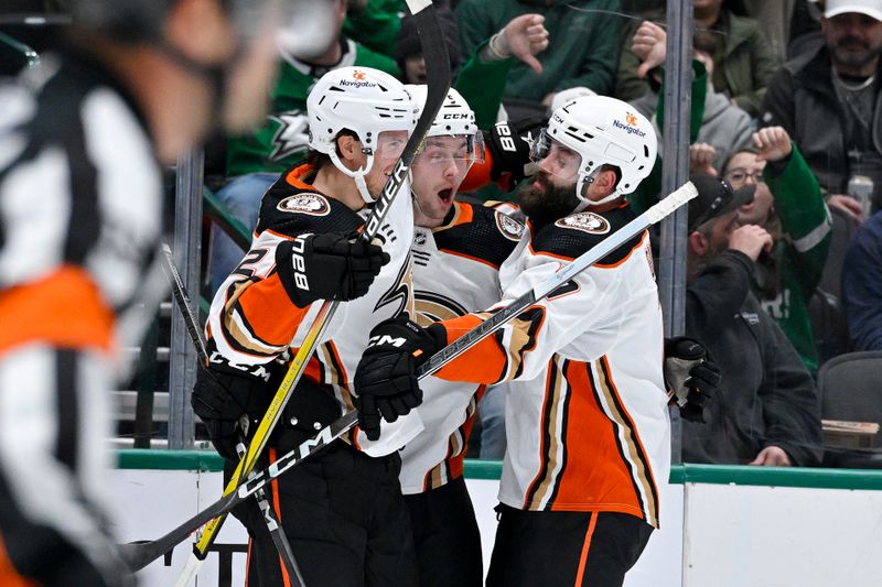 Jan 25, 2024; Dallas, Texas, USA; Anaheim Ducks center Isac Lundestrom (21) and defenseman Radko Gudas (7) and celebrates a goal scored by defenseman Urho Vaakanainen (5) against the Dallas Stars during the first period at the American Airlines Center. Mandatory Credit: Jerome Miron-USA TODAY Sports