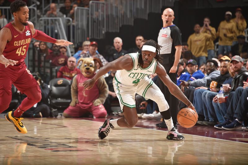 CLEVELAND, OH - DECEMBER 1: Jrue Holiday #4 of the Boston Celtics looks to pass the ball during the game against the Cleveland Cavaliers on December 1, 2024 at Rocket Mortgage FieldHouse in Cleveland, Ohio. NOTE TO USER: User expressly acknowledges and agrees that, by downloading and/or using this Photograph, user is consenting to the terms and conditions of the Getty Images License Agreement. Mandatory Copyright Notice: Copyright 2024 NBAE (Photo by David Liam Kyle/NBAE via Getty Images)