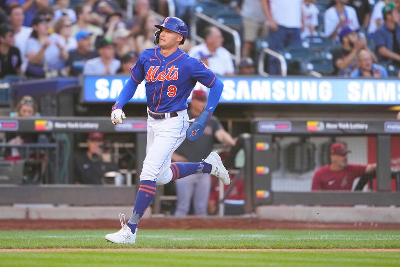 Sep 14, 2023; New York City, New York, USA; New York Mets center fielder Brandon Nimmo (9) scores a run on an RBI double hit by New York Mets first baseman Pete Alonso (not pictured) against the Arizona Diamondbacks during the fifth inning at Citi Field. Mandatory Credit: Gregory Fisher-USA TODAY Sports