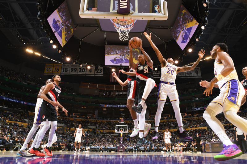 LOS ANGELES, CA - DECEMBER 8: Jabari Walker #34 of the Portland Trail Blazers goes up for the rebound during the game against the Los Angeles Lakers on December 8, 2024 at Crypto.Com Arena in Los Angeles, California. NOTE TO USER: User expressly acknowledges and agrees that, by downloading and/or using this Photograph, user is consenting to the terms and conditions of the Getty Images License Agreement. Mandatory Copyright Notice: Copyright 2024 NBAE (Photo by Adam Pantozzi/NBAE via Getty Images)