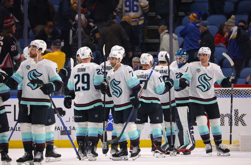 Jan 9, 2024; Buffalo, New York, USA;  The Seattle Kraken celebrate a win over the Buffalo Sabres at KeyBank Center. Mandatory Credit: Timothy T. Ludwig-USA TODAY Sports