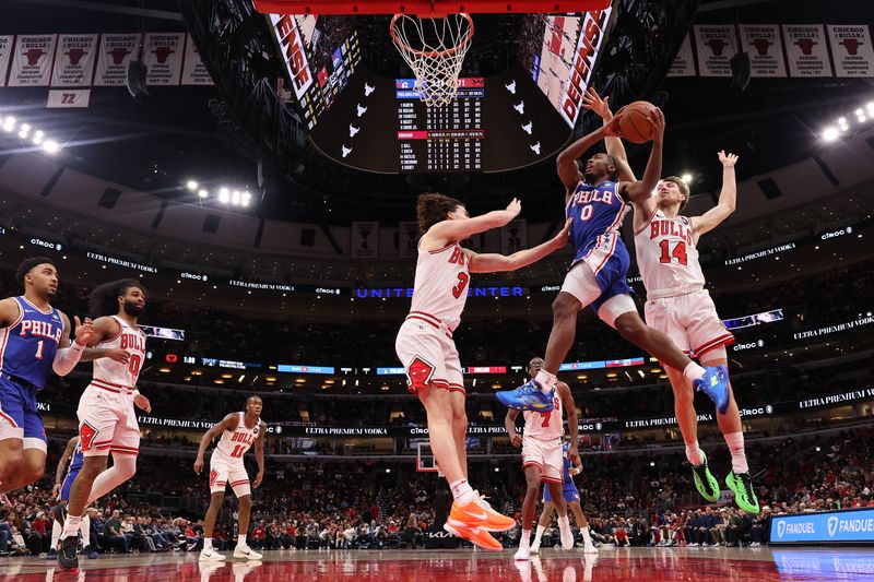 CHICAGO, ILLINOIS - DECEMBER 08: Tyrese Maxey #0 of the Philadelphia 76ers goes up for a layup against Matas Buzelis #14 of the Chicago Bulls during the second half at the United Center on December 08, 2024 in Chicago, Illinois. NOTE TO USER: User expressly acknowledges and agrees that, by downloading and or using this photograph, User is consenting to the terms and conditions of the Getty Images License Agreement.  (Photo by Michael Reaves/Getty Images)