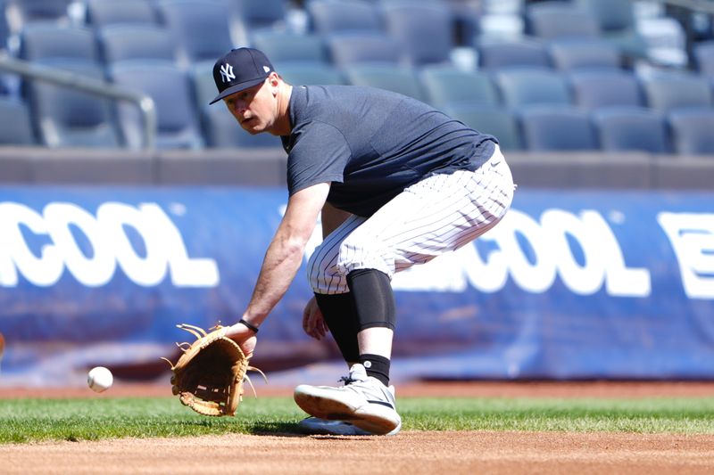 Apr 22, 2024; Bronx, New York, USA; New York Yankees third baseman DJ LeMahieu (26) takes infield practice before a game against the Oakland Athletics at Yankee Stadium. Mandatory Credit: Gregory Fisher-USA TODAY Sports