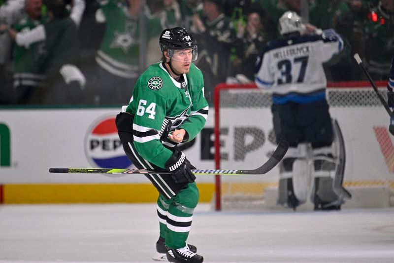 May 13, 2025; Dallas, Texas, USA; Dallas Stars center Mikael Granlund (64) skates off the ice after he scores a power-play goal against against Winnipeg Jets goaltender Connor Hellebuyck (37) during the first period in game four of the second round of the 2025 Stanley Cup Playoffs at American Airlines Center. Mandatory Credit: Jerome Miron-Imagn Images