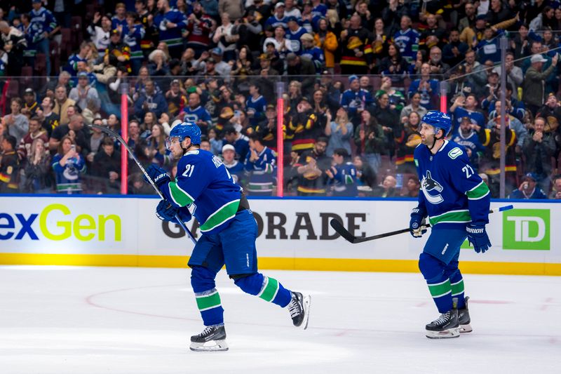 Oct 11, 2024; Vancouver, British Columbia, CAN; Vancouver Canucks forward Nils Hoglander (21) and defenseman Derek Forbort (27) celebrate Hoglander’s goal against the Philadelphia Flyers during the first period at Rogers Arena. Mandatory Credit: Bob Frid-Imagn Images