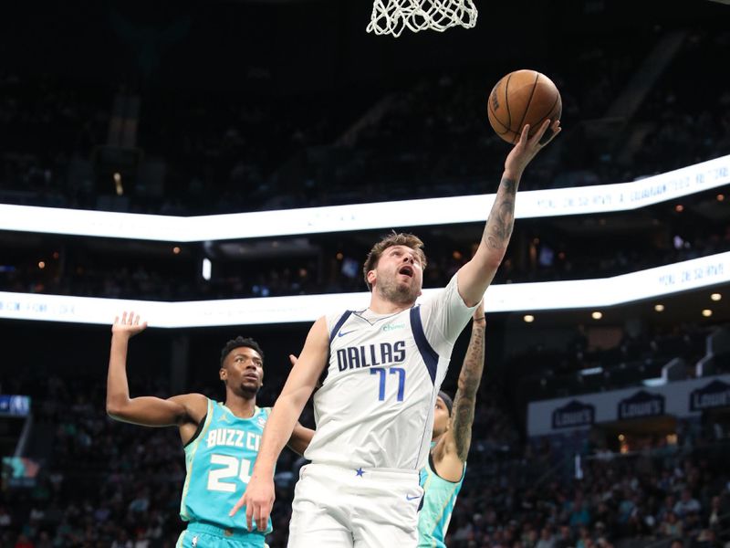 CHARLOTTE, NC - APRIL 9: Luka Doncic #77 of the Dallas Mavericks shoots the ball during the game against the Charlotte Hornets on April 9, 2024 at Spectrum Center in Charlotte, North Carolina. NOTE TO USER: User expressly acknowledges and agrees that, by downloading and or using this photograph, User is consenting to the terms and conditions of the Getty Images License Agreement. Mandatory Copyright Notice: Copyright 2024 NBAE (Photo by Brock Williams-Smith/NBAE via Getty Images)