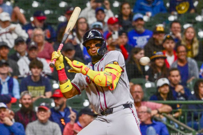 Jun 9, 2025; Milwaukee, Wisconsin, USA; Atlanta Braves right fielder Ronald Acuna (13) ducks away from an inside pitch in the ninth inning against the Milwaukee Brewers at American Family Field. Mandatory Credit: Benny Sieu-Imagn Images