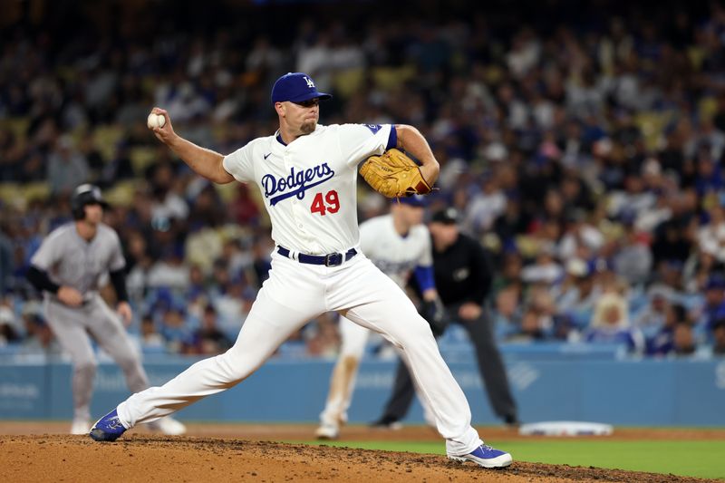 Jun 1, 2024; Los Angeles, California, USA;  Los Angeles Dodgers relief pitcher Blake Treinen (49) pitches during the eighth inning against the Colorado Rockies at Dodger Stadium. Mandatory Credit: Kiyoshi Mio-USA TODAY Sports