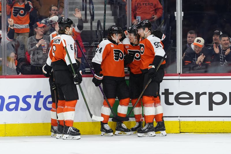 Mar 11, 2026; Philadelphia, Pennsylvania, USA; Philadelphia Flyers center Trevor Zegras (46) celebrates with teammates after scoring a goal against the Washington Capitals in the second period at Xfinity Mobile Arena. Mandatory Credit: Kyle Ross-Imagn Images