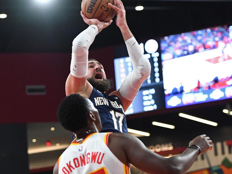 COLLEGE PARK, GA - OCTOBER 14: Jonas Valanciunas #17 of the New Orleans Pelicans shoots the ball during the game against the Atlanta Hawks on October 14, 2023 at Gateway Center Arena in College Park, Georgia.  NOTE TO USER: User expressly acknowledges and agrees that, by downloading and/or using this Photograph, user is consenting to the terms and conditions of the Getty Images License Agreement. Mandatory Copyright Notice: Copyright 2023 NBAE (Photo by Scott Cunningham/NBAE via Getty Images)