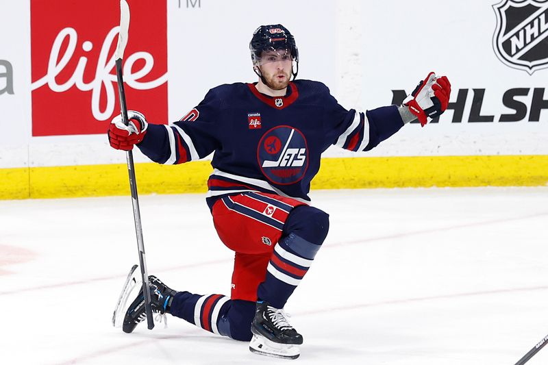 Apr 2, 2023; Winnipeg, Manitoba, CAN; Winnipeg Jets left wing Pierre-Luc Dubois (80) celebrates his third period goal against the New Jersey Devils at Canada Life Centre. Mandatory Credit: James Carey Lauder-USA TODAY Sports