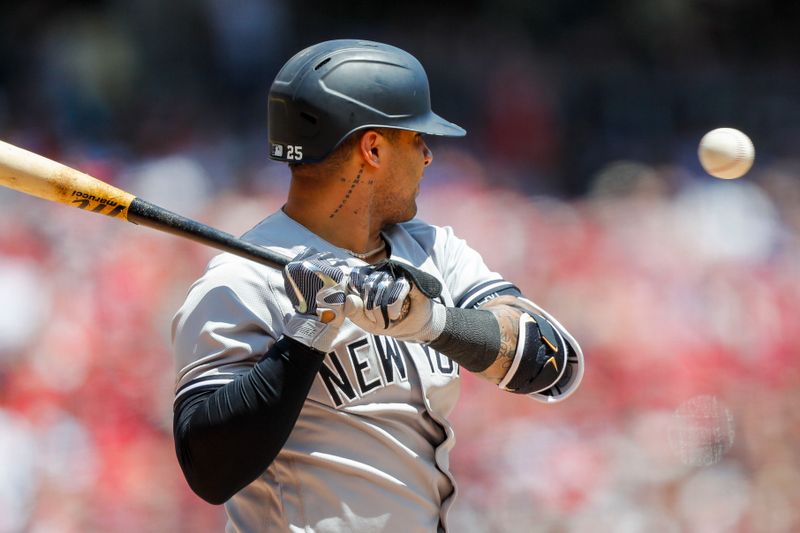 May 21, 2023; Cincinnati, Ohio, USA; New York Yankees second baseman Gleyber Torres (25) dodges a wild pitch by the Cincinnati Reds in the eighth inning at Great American Ball Park. Mandatory Credit: Katie Stratman-USA TODAY Sports