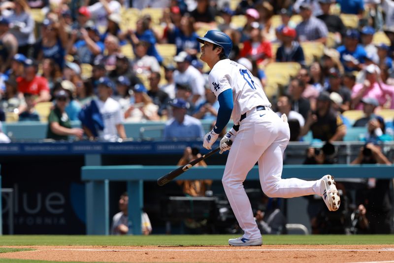 May 5, 2024; Los Angeles, California, USA;  Los Angeles Dodgers designated hitter Shohei Ohtani (17) hits a home run during the first inning against the Atlanta Braves at Dodger Stadium. Mandatory Credit: Kiyoshi Mio-USA TODAY Sports