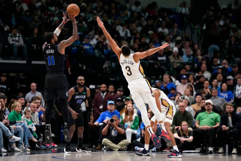 DALLAS, TEXAS - JANUARY 15: Kyrie Irving #11 of the Dallas Mavericks shoots as CJ McCollum #3 of the New Orleans Pelicans defends during the second half at American Airlines Center on January 15, 2024 in Dallas, Texas. NOTE TO USER: User expressly acknowledges and agrees that, by downloading and or using this photograph, User is consenting to the terms and conditions of the Getty Images License Agreement. (Photo by Sam Hodde/Getty Images)