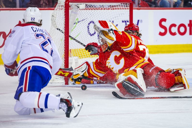 Mar 16, 2024; Calgary, Alberta, CAN; Calgary Flames goaltender Dustin Wolf (32) makes a save against Montreal Canadiens right wing Cole Caufield (22) during the first period at Scotiabank Saddledome. Mandatory Credit: Sergei Belski-USA TODAY Sports