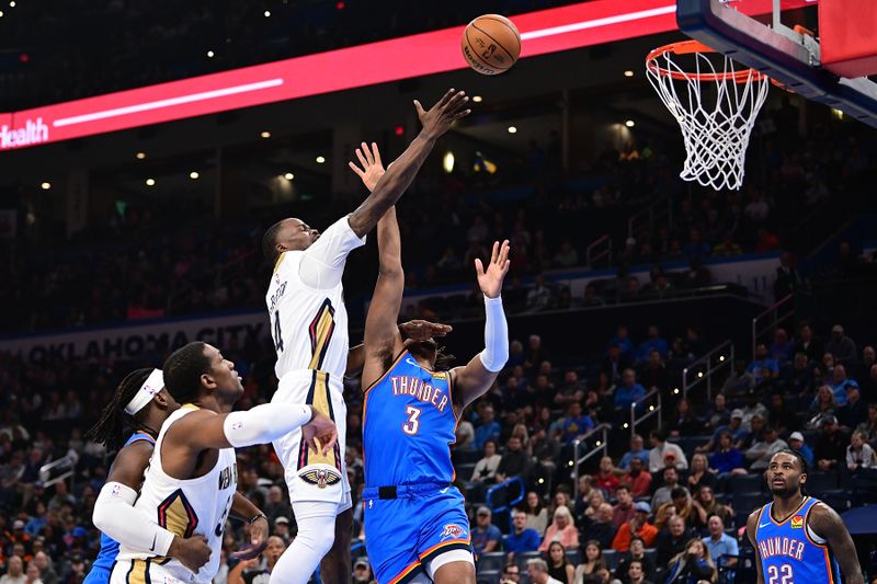 OKLAHOMA CITY, OKLAHOMA - NOVEMBER 13: Javonte Green #4 of the New Orleans Pelicans puts up a shot at the rim in front of Dillon Jones #3 of the Oklahoma City Thunder during the first half at Paycom Center on November 13, 2024 in Oklahoma City, Oklahoma. NOTE TO USER: User expressly acknowledges and agrees that, by downloading and or using this photograph, User is consenting to the terms and conditions of the Getty Images License Agreement. (Photo by Joshua Gateley/Getty Images)