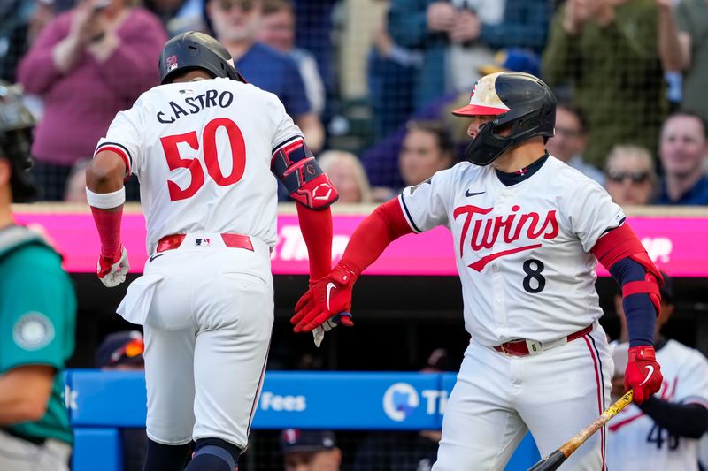 May 8, 2024; Minneapolis, Minnesota, USA; Minnesota Twins center fielder Willi Castro (50) celebrates with catcher Christian Vázquez (8) after hitting a solo home run against the Seattle Mariners in the second inning at Target Field. Mandatory Credit: Jesse Johnson-USA TODAY Sports