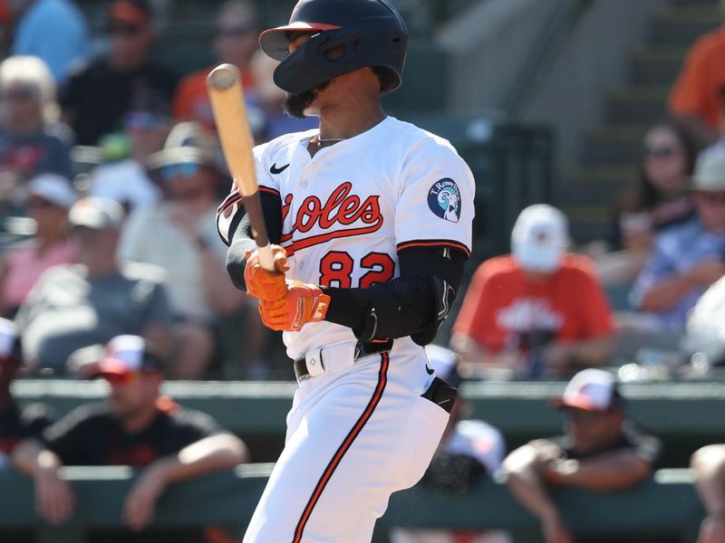 Feb 27, 2025; Sarasota, Florida, USA;  Baltimore Orioles infielder Jeremiah Jackson (82) singles during the sixth inning against the Toronto Blue Jays at Ed Smith Stadium. Mandatory Credit: Kim Klement Neitzel-Imagn Images