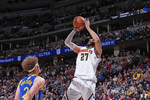 DENVER, CO - DECEMBER 25: Jamal Murray #27 of the Denver Nuggets shoots the ball during the game against the Golden State Warriors on December 25, 2023 at the Ball Arena in Denver, Colorado. NOTE TO USER: User expressly acknowledges and agrees that, by downloading and/or using this Photograph, user is consenting to the terms and conditions of the Getty Images License Agreement. Mandatory Copyright Notice: Copyright 2023 NBAE (Photo by Garrett Ellwood/NBAE via Getty Images)