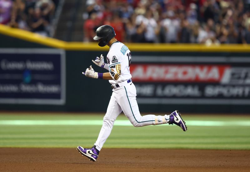 Aug 27, 2023; Phoenix, Arizona, USA; Arizona Diamondbacks outfielder Lourdes Gurriel Jr. celebrates a seventh inning solo home run against the Cincinnati Reds at Chase Field. Mandatory Credit: Mark J. Rebilas-USA TODAY Sports