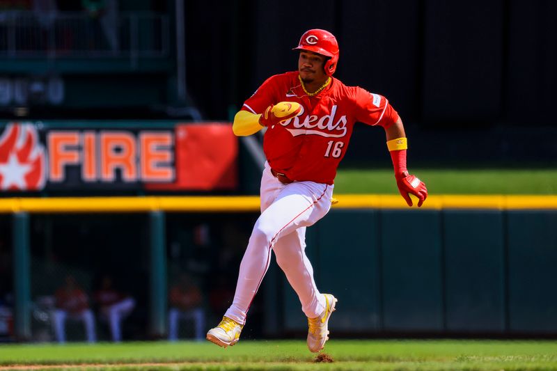 Sep 21, 2024; Cincinnati, Ohio, USA; Cincinnati Reds third baseman Noelvi Marte (16) scores on a RBI single hit by shortstop Elly De La Cruz (not pictured) in the sixth inning against the Pittsburgh Pirates at Great American Ball Park. Mandatory Credit: Katie Stratman-Imagn Images