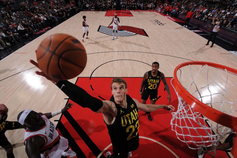 PORTLAND, OR - OCTOBER 18: Lauri Markkanen #23 of the Utah Jazz grabs the rebound during the game against the Portland Trail Blazers on October 18, 2024 at the Moda Center Arena in Portland, Oregon. NOTE TO USER: User expressly acknowledges and agrees that, by downloading and or using this photograph, user is consenting to the terms and conditions of the Getty Images License Agreement. Mandatory Copyright Notice: Copyright 2024 NBAE (Photo by Cameron Browne/NBAE via Getty Images)