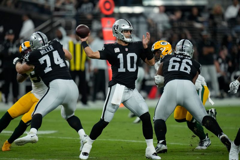 Las Vegas Raiders quarterback Jimmy Garoppolo (10) throws against the Green Bay Packers during an NFL football game, Monday, Oct. 9, 2023, in Las Vegas. (AP Photo/John Locher)