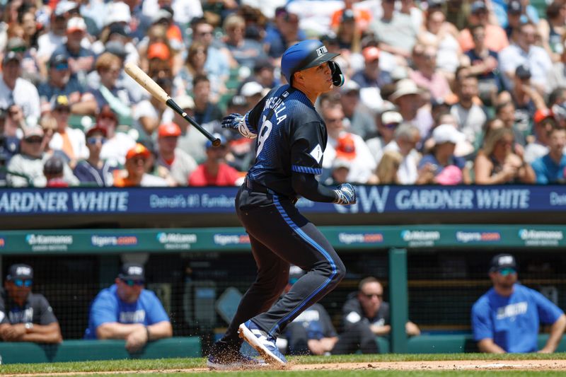 May 25, 2024; Detroit, Michigan, USA; Detroit Tigers third baseman Gio Urshela (13) hits in the first inning of the game against the Toronto Blue Jays at Comerica Park. Mandatory Credit: Brian Bradshaw Sevald-USA TODAY Sports