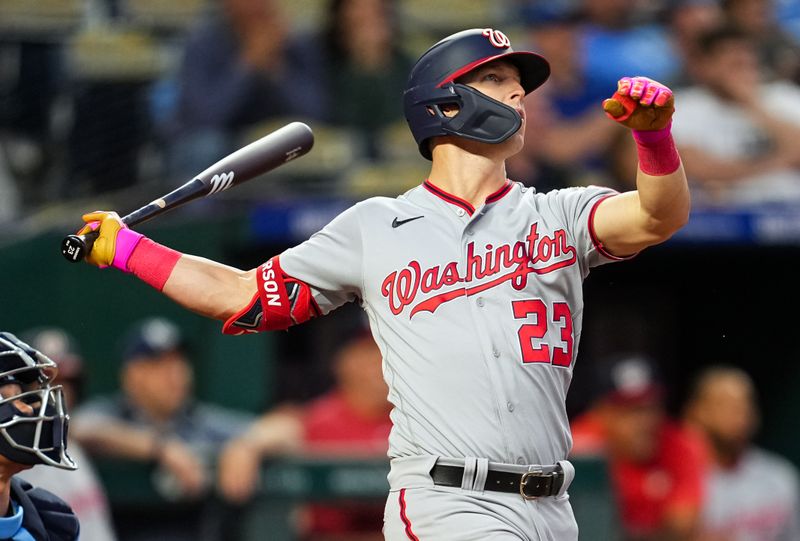 May 26, 2023; Kansas City, Missouri, USA; Washington Nationals left fielder Corey Dickerson (23) hits a home run against the Kansas City Royals during the sixth inning  at Kauffman Stadium. Mandatory Credit: Jay Biggerstaff-USA TODAY Sports