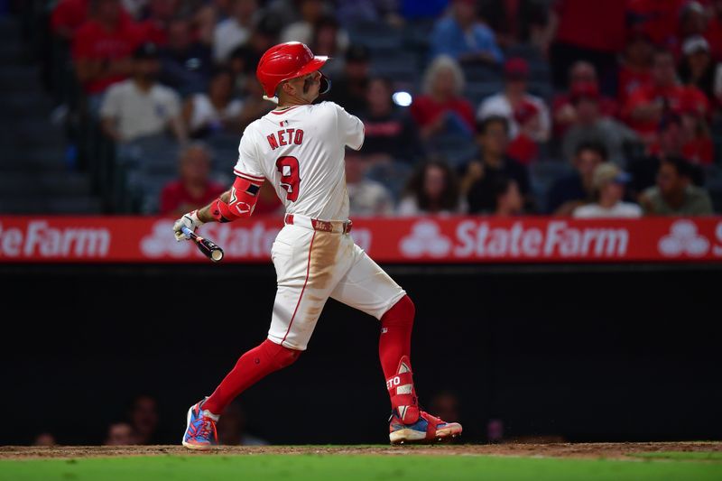 Aug 13, 2024; Anaheim, California, USA;  Los Angeles Angels shortstop Zach Neto (9) hits a single against the Toronto Blue Jays during the fifth inning at Angel Stadium. Mandatory Credit: Gary A. Vasquez-USA TODAY Sports