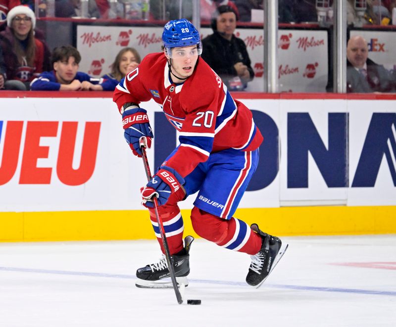 Dec 20, 2025; Montreal, Quebec, CAN; Montreal Canadiens forward Juraj Slafkovsky (20) plays the puck  during the second period of the game against the Pittsburgh Penguins at the Bell Centre. Mandatory Credit: Eric Bolte-Imagn Images