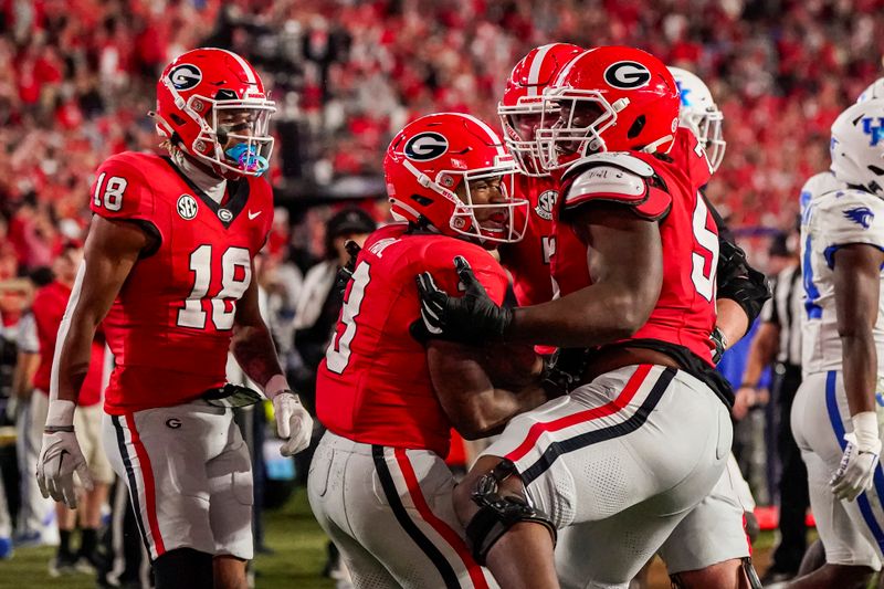 Oct 7, 2023; Athens, Georgia, USA; Georgia Bulldogs running back Andrew Paul (3) reacts with teammates after scoring a touchdown against the Kentucky Wildcats during the second half at Sanford Stadium. Mandatory Credit: Dale Zanine-USA TODAY Sports