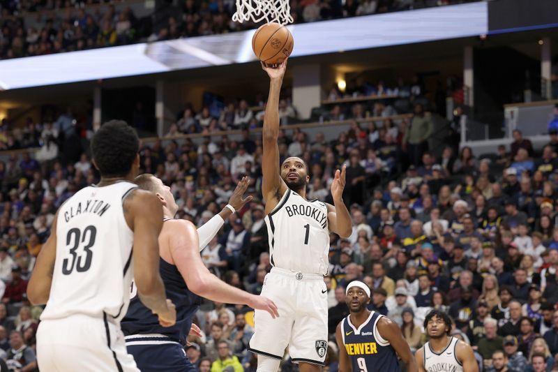 DENVER, COLORADO - DECEMBER 14: Mikal Bridges #1 of the Brooklyn Nets goes to the basket against the Denver Nuggets in the third quarter at Ball Arena on December 14, 2023 in Denver, Colorado. NOTE TO USER: User expressly acknowledges and agrees that, by downloading and or using this photograph, User is consenting to the terms and conditions of the Getty Images License Agreement.   (Photo by Matthew Stockman/Getty Images)