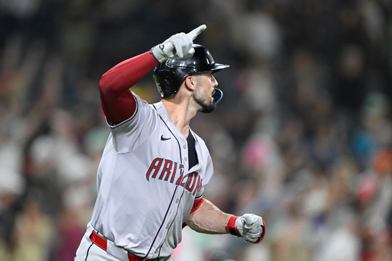 July 5, 2024; San Diego, California, USA; Arizona Diamondbacks right fielder Randal Grichuk (15) celebrates after hitting a two-run home run during the ninth inning against the San Diego Padres at Petco Park. Mandatory Credit: Denis Poroy-USA TODAY Sports