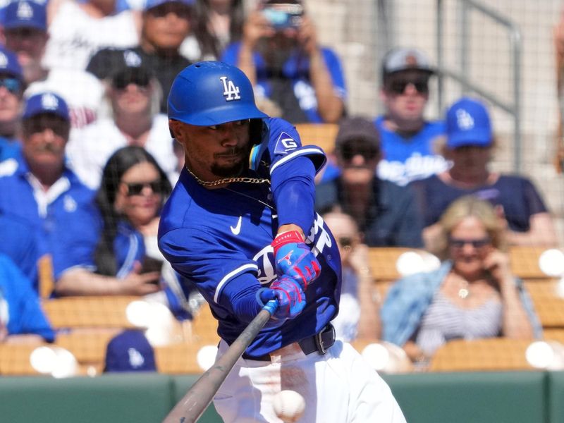 Mar 10, 2024; Phoenix, Arizona, USA; Los Angeles Dodgers infielder Mookie Betts (50) bats against the Arizona Diamondbacks during the first inning at Camelback Ranch-Glendale. Mandatory Credit: Joe Camporeale-USA TODAY Sports