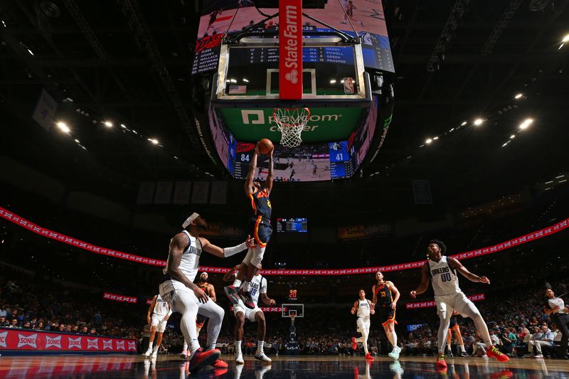 OKLAHOMA CITY, OK - APRIL 14: Cason Wallace #22 of the Oklahoma City Thunder  shoots the ball during the game against the Dallas Mavericks  on April 14, 2024 at Paycom Arena in Oklahoma City, Oklahoma. NOTE TO USER: User expressly acknowledges and agrees that, by downloading and or using this photograph, User is consenting to the terms and conditions of the Getty Images License Agreement. Mandatory Copyright Notice: Copyright 2024 NBAE (Photo by Zach Beeker/NBAE via Getty Images)