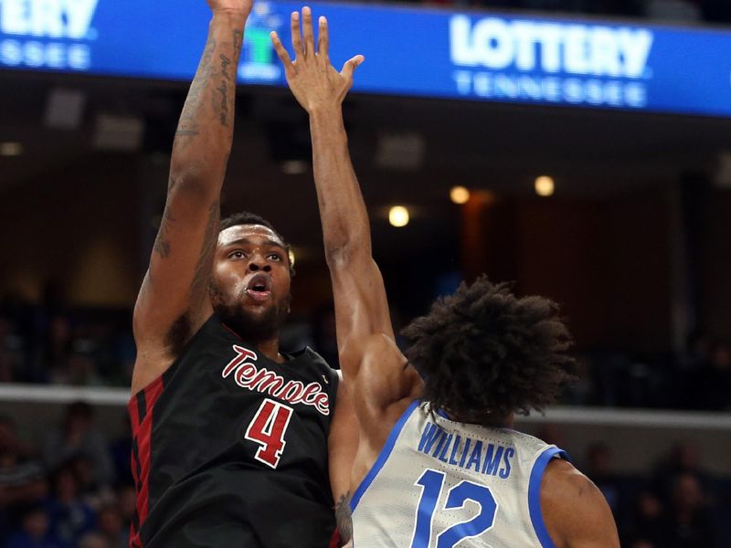 Feb 12, 2023; Memphis, Tennessee, USA; Temple Owls forward Jamille Reynolds (4) shoots as Memphis Tigers forward DeAndre Williams (12) defends during the second half at FedExForum. Mandatory Credit: Petre Thomas-USA TODAY Sports