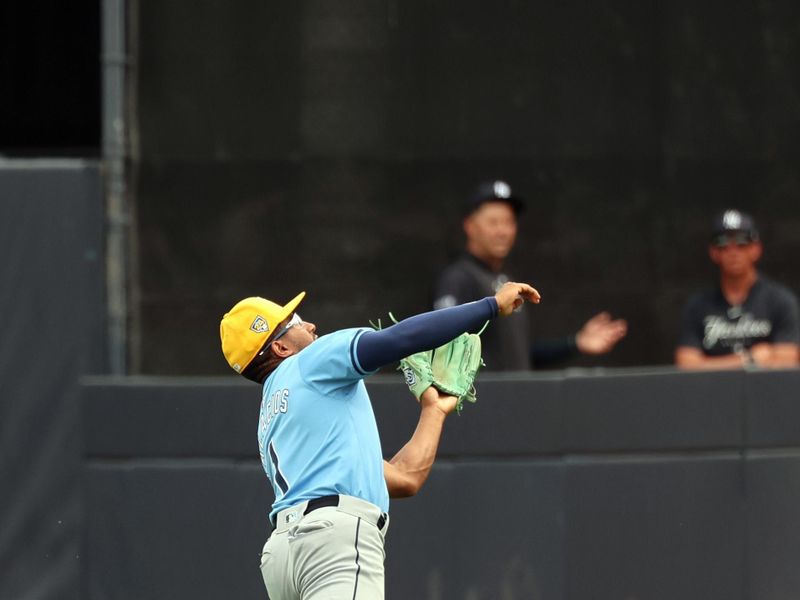 Mar 6, 2024; Tampa, Florida, USA;  Tampa Bay Rays outfielder Richie Palacios (1) catches a fly ball during the second inning against the New York Yankees at George M. Steinbrenner Field. Mandatory Credit: Kim Klement Neitzel-USA TODAY Sports