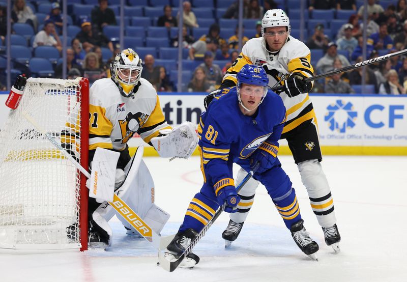 Sep 21, 2024; Buffalo, New York, USA;  Buffalo Sabres center Sam Lafferty (81) and Pittsburgh Penguins defenseman Ryan Shea (5) look for the pun during the second period at KeyBank Center. Mandatory Credit: Timothy T. Ludwig-Imagn Images