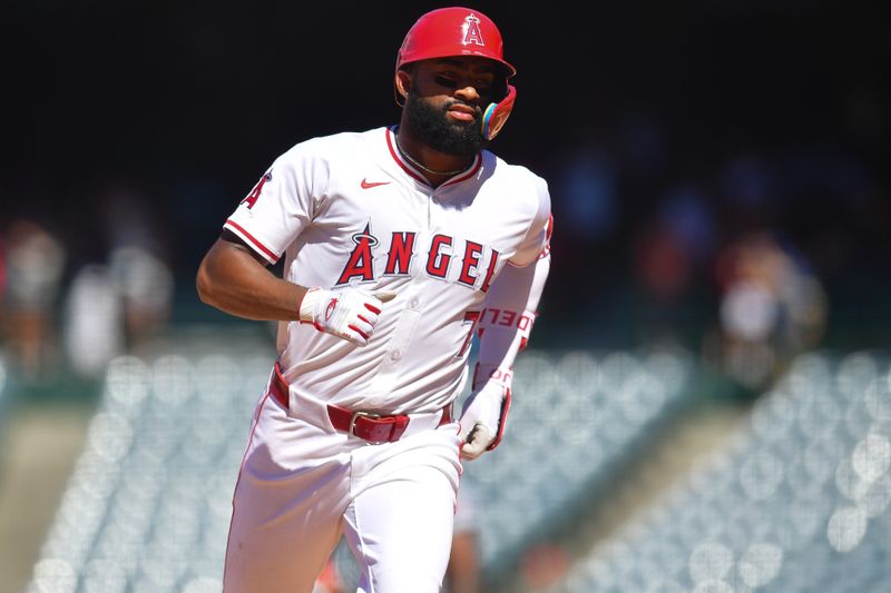 Jun 27, 2024; Anaheim, California, USA; Los Angeles Angels right fielder Jo Adell (7) runs the bases after hitting a two run home run against the Detroit Tigers during the ninth inning at Angel Stadium. Mandatory Credit: Gary A. Vasquez-USA TODAY Sports