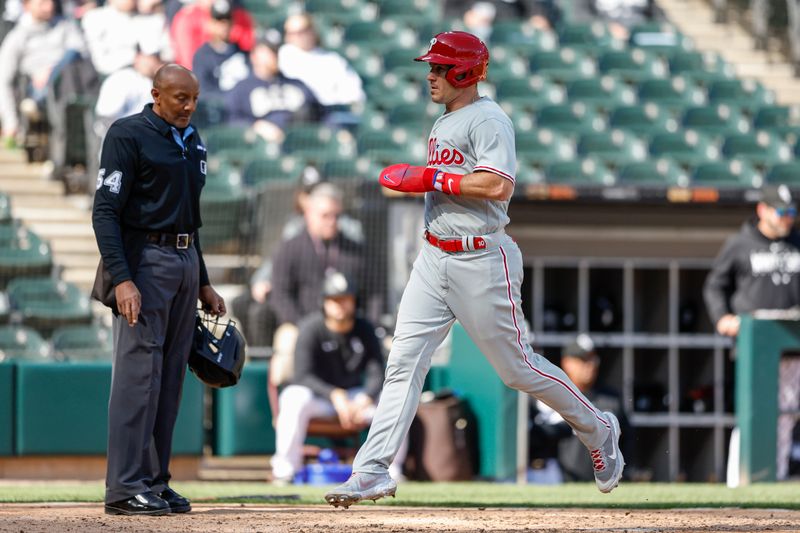 Apr 18, 2023; Chicago, Illinois, USA; Philadelphia Phillies catcher J.T. Realmuto (10) scores against the Chicago White Sox during the third inning of game one of the doubleheader at Guaranteed Rate Field. Mandatory Credit: Kamil Krzaczynski-USA TODAY Sports