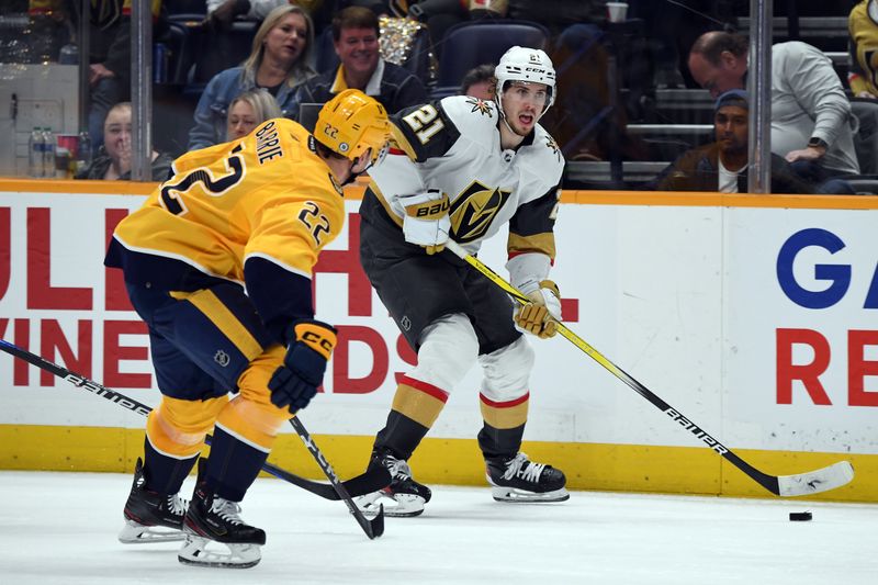 Mar 26, 2024; Nashville, Tennessee, USA; Vegas Golden Knights center Brett Howden (21) skates with the puck against Nashville Predators defenseman Tyson Barrie (22) during the second period at Bridgestone Arena. Mandatory Credit: Christopher Hanewinckel-USA TODAY Sports