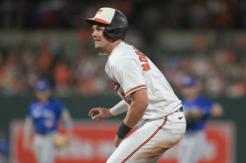 Aug 23, 2023; Baltimore, Maryland, USA;  Baltimore Orioles first baseman Ryan Mountcastle (6) reacts a over throws to first base during the  third inning rundown against the Toronto Blue Jays at Oriole Park at Camden Yards. Mandatory Credit: Tommy Gilligan-USA TODAY Sports