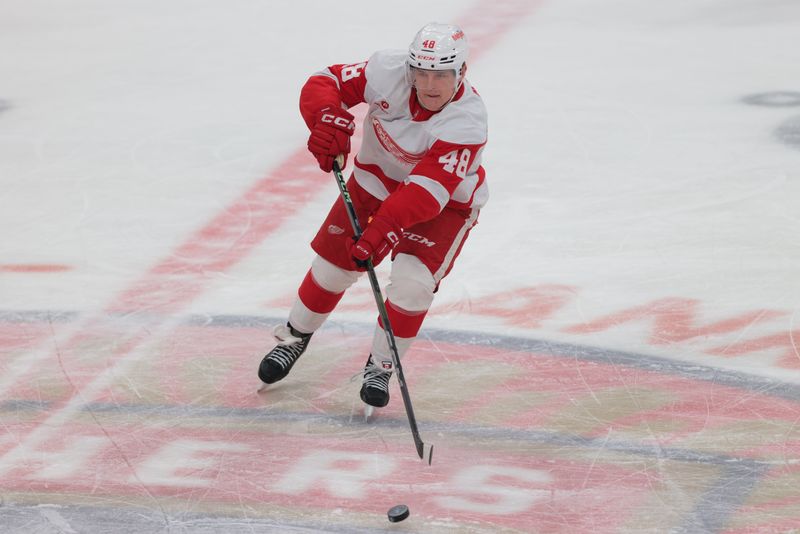 Jan 16, 2025; Sunrise, Florida, USA; Detroit Red Wings right wing Jonatan Berggren (48) moves the puck against the Florida Panthers during the second period at Amerant Bank Arena. Mandatory Credit: Sam Navarro-Imagn Images