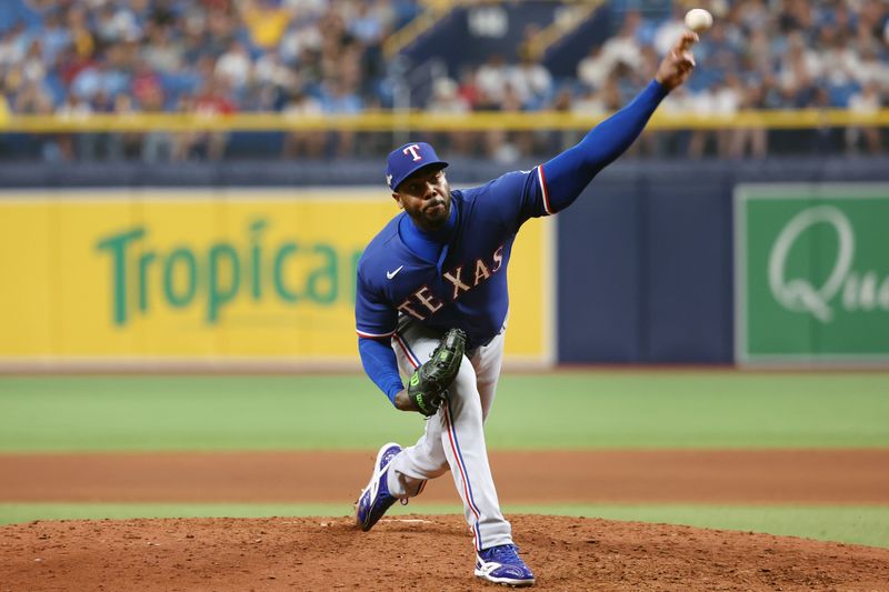 Oct 3, 2023; St. Petersburg, Florida, USA; Texas Rangers relief pitcher Aroldis Chapman (45) pitches against the Tampa Bay Rays in the eighth inning during game one of the Wildcard series for the 2023 MLB playoffs at Tropicana Field. Mandatory Credit: Kim Klement Neitzel-USA TODAY Sports