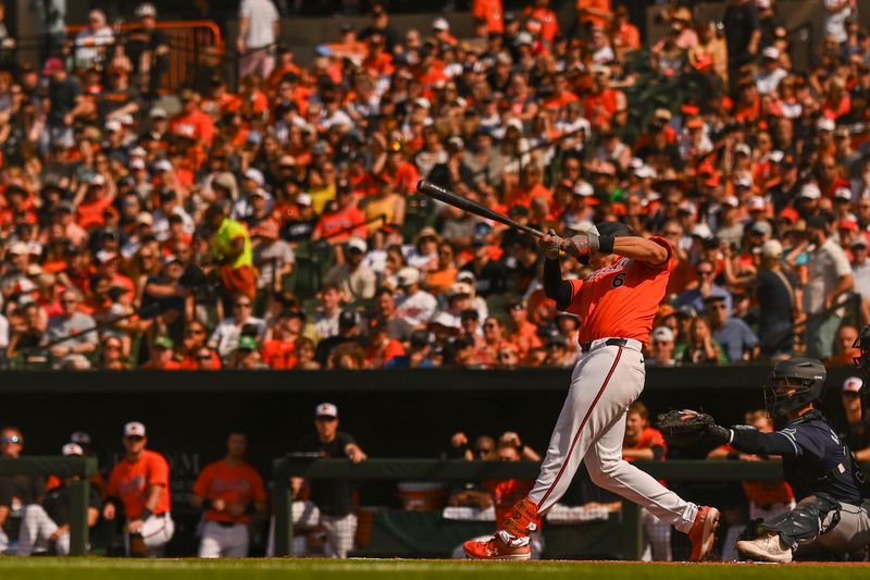 Jun 1, 2024; Baltimore, Maryland, USA;  Baltimore Orioles first baseman Ryan Mountcastle (6) hits a two run home run in the first inning against the Tampa Bay Rays at Oriole Park at Camden Yards. Mandatory Credit: Tommy Gilligan-USA TODAY Sports