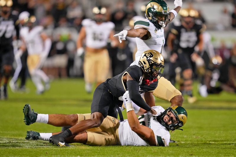 Sep 16, 2023; Boulder, Colorado, USA; Colorado State Rams defensive back Henry Blackburn (11) makes an interception on a pass intended for Colorado Buffaloes wide receiver Jimmy Horn Jr. (5) in the first quarter at Folsom Field. Mandatory: Andrew Wevers-USA TODAY Sports