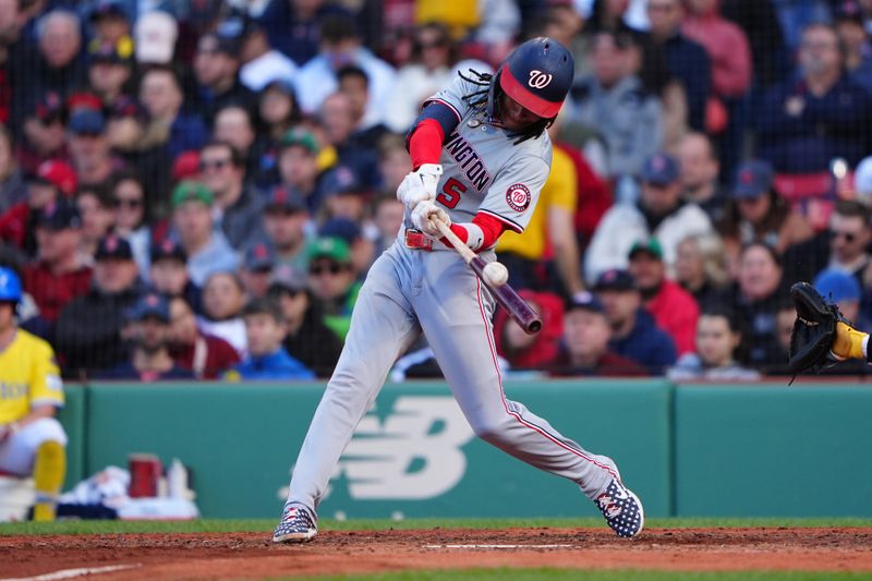May 11, 2024; Boston, Massachusetts, USA; Washington Nationals shortstop CJ Abrams (5) hits a single against the Boston Red Sox during the sixth inning at Fenway Park. Mandatory Credit: Gregory Fisher-USA TODAY Sports