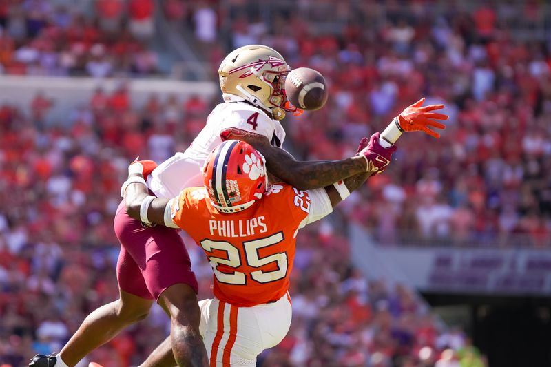 Sep 23, 2023; Clemson, South Carolina, USA; Clemson Tigers safety Jalyn Phillips (25) disrupts a pass intended for Florida State Seminoles wide receiver Keon Coleman (4) in the second half at Memorial Stadium. Mandatory Credit: David Yeazell-USA TODAY Sports